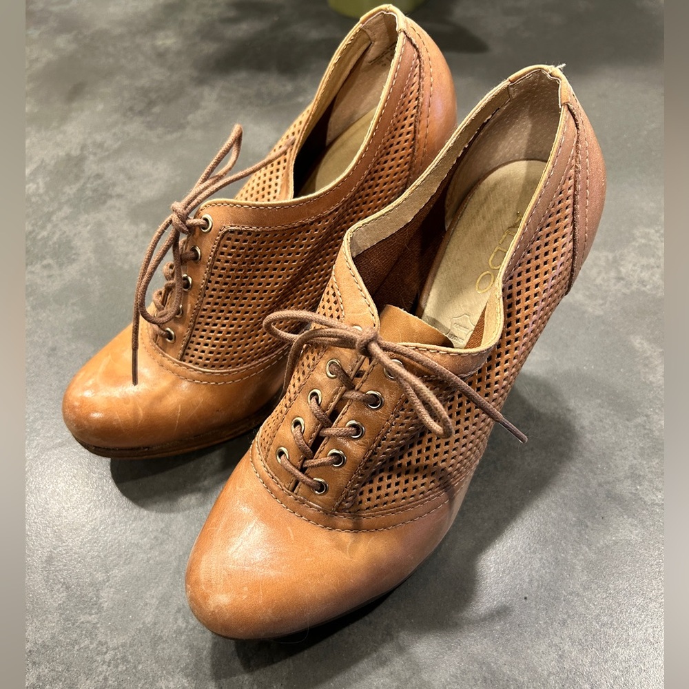 Aldo leather pumps with mesh upper.